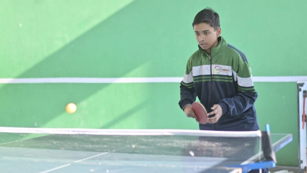 Tisa student playing table tennis in indoor sport club