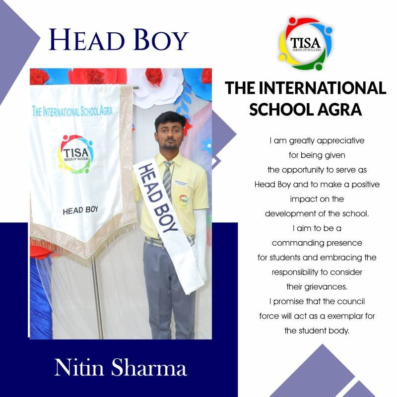Portrait of nitin sharma, head boy of the international school agra, wearing a yellow shirt, grey trousers, and a white sash labeled "head boy". He stands next to a banner with the school logo and the words "head boy". Text on the right includes his message of gratitude for the opportunity, commitment to being a commanding and responsible presence for students, and a promise to serve as an exemplar through the student council. The school logo and name are also prominently displayed.