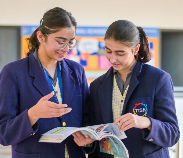 Tisa students reading the books 1