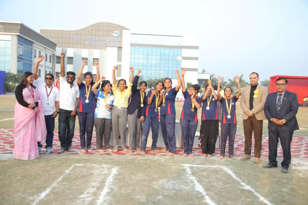 Co-curriculars in agra: choosing the right activities for students 4 Tisa students celebrating with medals during the annual sports day award ceremony.