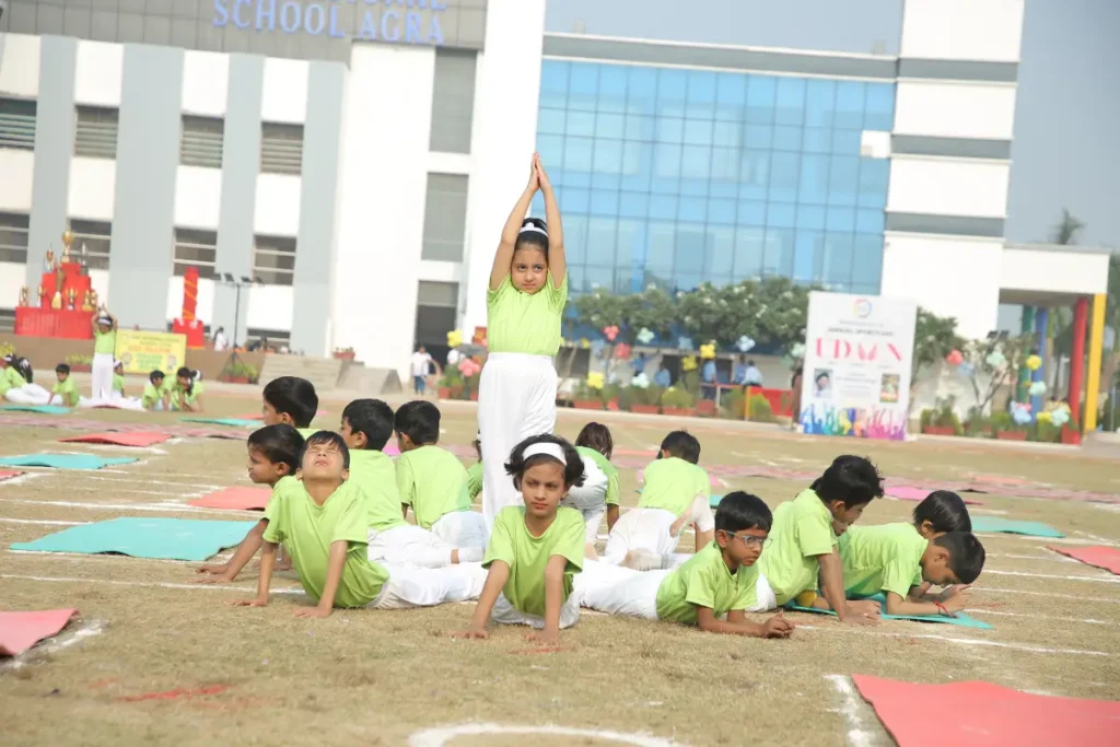 Co-curriculars in agra: choosing the right activities for students 1 Tisa students performing a synchronized yoga display during annual sports day.